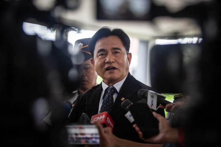 Coordinating Law, Human Rights, Immigration and Correctional Services Minister Yusril Ihza Mahendra speaks to the media on Feb. 24, 2025, upon arriving at the Military Academy in Magelang, Central Java, to participate as a speaker in a regional leaders&rsquo; retreat.