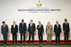 (left to right) Indonesia's Foreign Minister Sugiono, Iran's Foreign Minister Abbas Araghchi, South Africa's Foreign Minister Ronald Lamola, Russia's Foreign Minister Sergei Lavrov, India's Foreign Minister Subrahmanyam Jaishankar, Brazil's Foreign Minister Mauro Vieira, Egypt's Foreign Minister Badr Abdelatty, and Ethiopia's Foreign Minister Gedion Timothewos pose for a family photograph during the BRICS Foreign Ministers Meeting at the Bharat Mandapam in New Delhi on May 14, 2026.