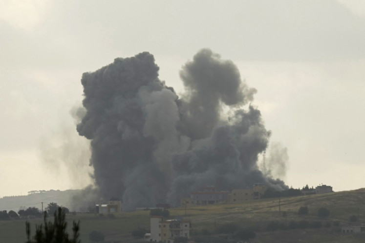 Smoke rises from the site of an Israeli airstrike that targeted the southern Lebanese village of Kfar Tibnit on May 15, 2026. Israel carried out new strikes in southern Lebanon that it said targeted the militant group Hezbollah on May 15, hours before the two countries' envoys were set to meet for a second day of peace talks in Washington.
