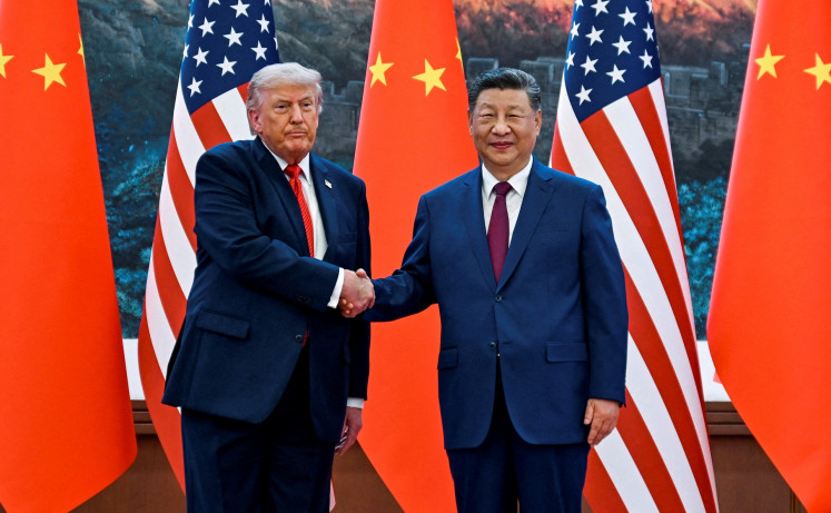 United States President Donald Trump (left) greets Chinese President Xi Jinping in events at the Great Hall of the People in Beijing, China on May 14, 2026, during a trip focused on trade, regional security, and strengthening bilateral ties between the world&rsquo;s two largest economies.