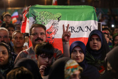 A man gestures as people gather at a farewell ceremony for Iran's national soccer team in Tehran, Iran, on May 13, 2026 ahead of their departure to the 2026 World Cup.