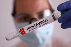 A test tube labelled &ldquo;Hantavirus positive&ldquo; is held in this illustration taken on May 7, 2026.