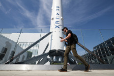 A SpaceX Falcon 9 rocket is displayed outside a Space Exploration Technologies Corp. facility in Hawthorne, United States, on March 26, 2026.