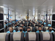 Indonesian deportees sit aboard a ferry during their trip from Malaysia to Batam Centre Point International Ferry Terminal in Batam, the Riau Islands, in this undated picture.