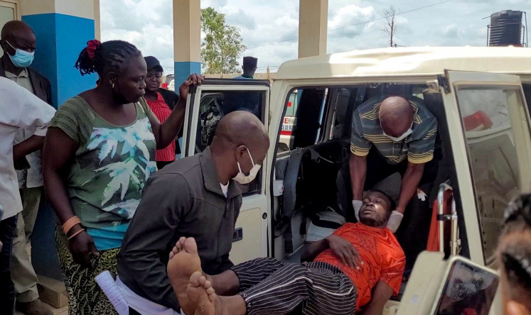 A man is carried from an ambulance as he arrives at Bunia General Referral Hospital on May 16 following confirmation of an Ebola outbreak involving the Bundibugyo strain in Bunia, Ituri province, Democratic Republic of Congo. 