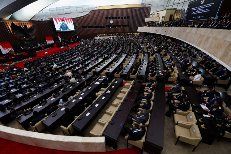 A large screen displays President Prabowo Subianto as he delivers his speech on economic policies and the 2027 fiscal plan House of Representatives members at the Senayan Legislative Complex in Central Jakarta on May 20, 2026. 