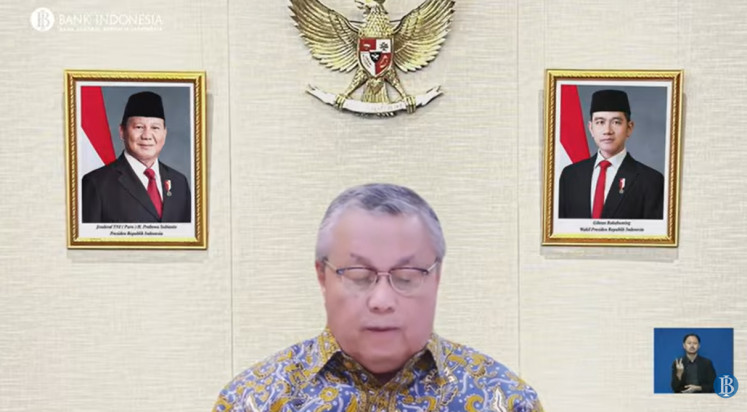 A screenshot shows Bank Indonesia (BI) Governor Perry Warjiyo presenting the results of BI's latest Board of Governors Meeting in an online press conference in Jakarta on May 20, 2026.