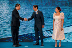 Vietnam's Prime Minister Le Minh Hung (left) is greeted by Philippine President Ferdinand Marcos Jr. (center) and his wife Liza Araneta Marcos during a welcome ceremony for the 48th ASEAN Summit in Cebu, central Philippines, on May 8, 2026.