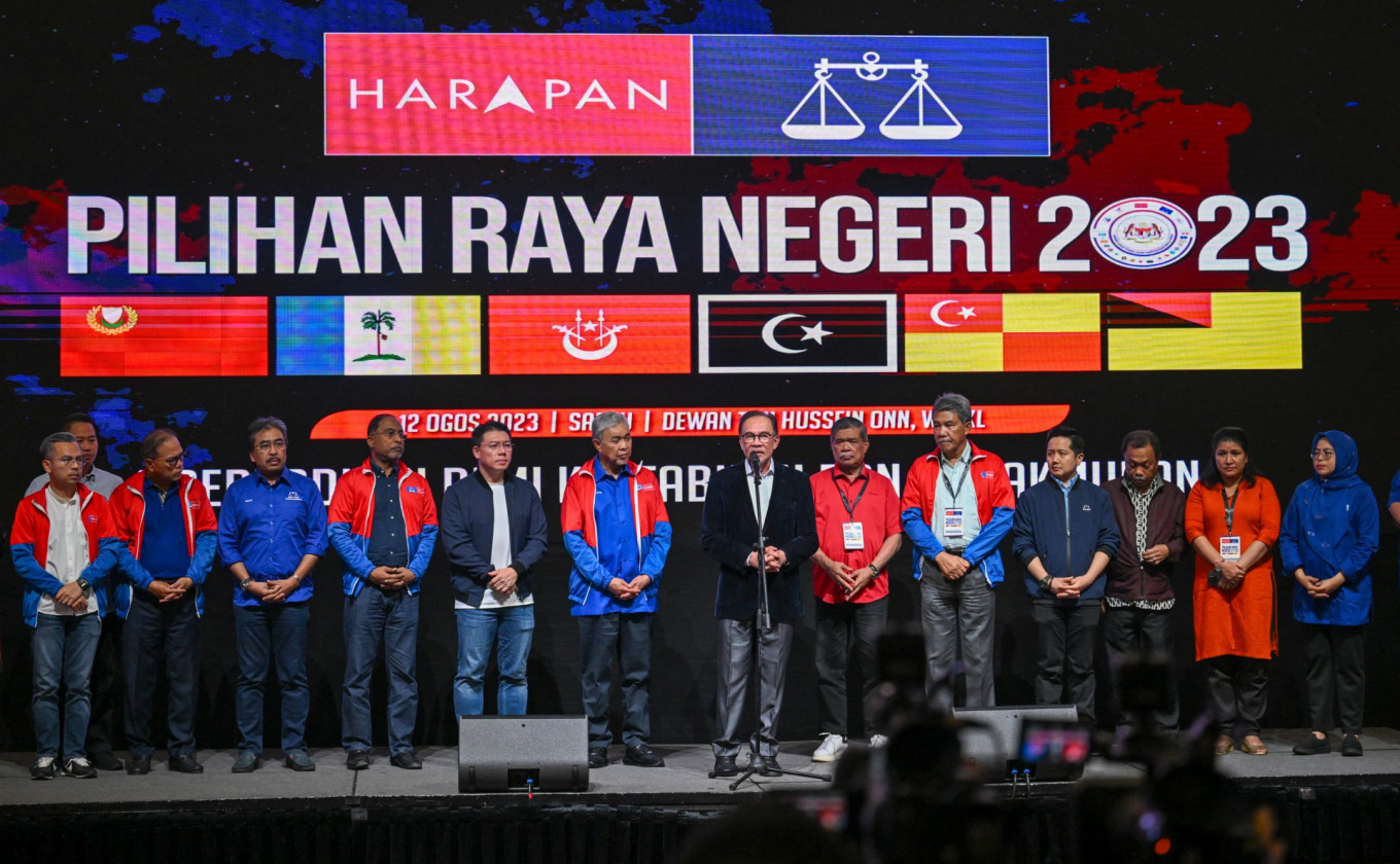 Malaysia's Prime Minister Anwar Ibrahim (center) speaks during a press conference after the release of state election results at the World Trade Centre in Kuala Lumpur on Aug. 12, 2023.