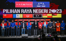 Malaysia's Prime Minister Anwar Ibrahim (center) speaks during a press conference after the release of state election results at the World Trade Centre in Kuala Lumpur on Aug. 12, 2023.