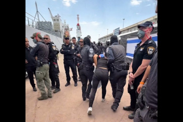 This screen grab taken from footage released on Israeli National Security Minister Itamar Ben Gvir&rsquo;s X account on May 20, 2026 shows shows a detained activist from the Gaza-bound aid flotilla being escorted by security forces with their hands tied behind their backs.