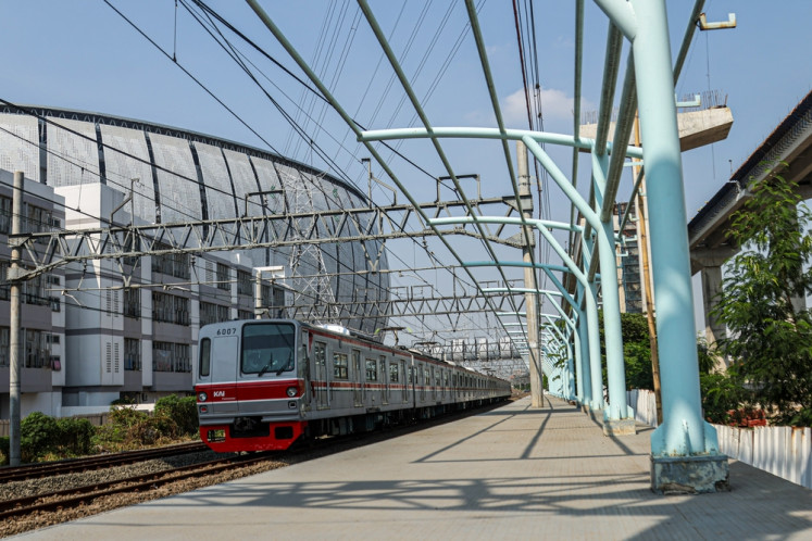 A Greater Jakarta Commuter train passes through the under-construction Jakarta International Stadium (JIS) railway station on Oct. 14, 2025, in North Jakarta. The station, located next to the stadium, will be directly connected with the 82,000-seat JIS. 