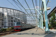 A Greater Jakarta Commuter train passes through the under-construction Jakarta International Stadium (JIS) railway station on Oct. 14, 2025, in North Jakarta. The station, located next to the stadium, will be directly connected with the 82,000-seat JIS. 