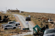 Israeli flags flutter near the Palestinian village of Um Al-Khair in Masafer Yatta in the Israeli-occupied West Bank, on May 20, 2026.