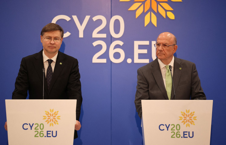 European Commissioner for Economy and Productivity Valdis Dombrovskis and Cyprus' Minister of Finance Makis Keravnos attend a press conference during an informal meeting of the Economic and Financial Affairs Council (ECOFIN), in Nicosia on May 23, 2026. 
