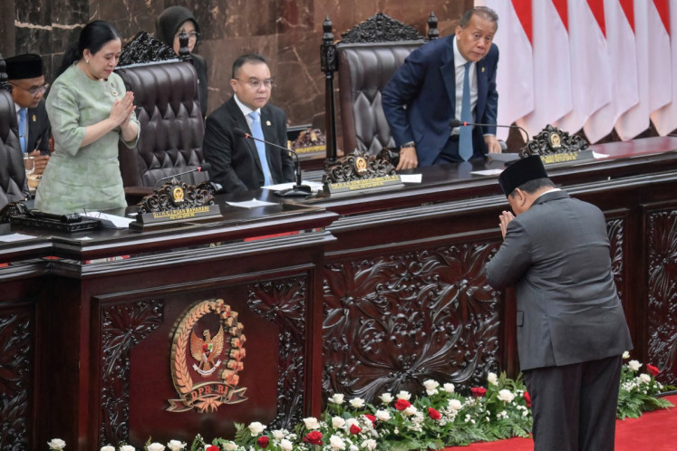 President Prabowo Subianto (right) greets House of Representatives Speaker Puan Maharani (left) before delivering a speech on the national macroeconomic framework to lawmakers on May 20 at the Senayan legislative complex in Central Jakarta.