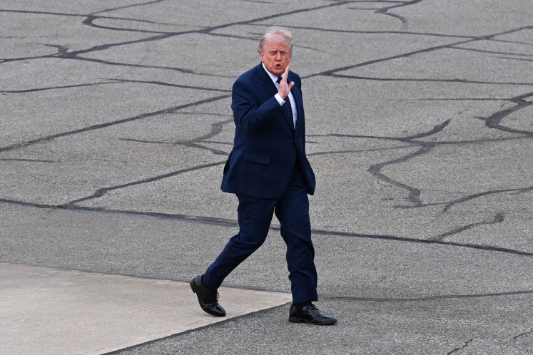 US President Donald Trump speaks to members of the media as he walks to board Air Force One at Morristown Airport after delivering remarks at SUNY Rockland Community College on May 22, 2026, in Morristown, New Jersey, United States.