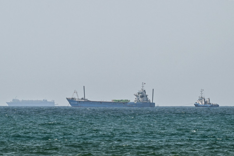 Vessels are anchored off the coast of Sharjah in the United Arab Emirates on May 21, 2026. Iran's new body overseeing the Strait of Hormuz said its claimed area of control extends to Emirati waters, drawing a sharp rebuke from the Gulf neighbor. Traffic through Hormuz, a vital global shipping conduit, has come under Iranian control since the outbreak of war with Israel and the United States on February 28.