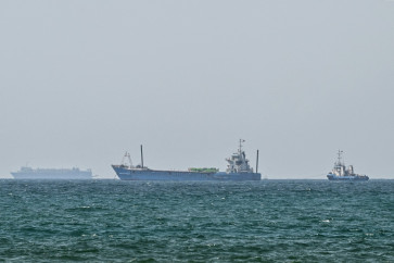 Vessels are anchored off the coast of Sharjah in the United Arab Emirates on May 21, 2026. Iran's new body overseeing the Strait of Hormuz said its claimed area of control extends to Emirati waters, drawing a sharp rebuke from the Gulf neighbor. Traffic through Hormuz, a vital global shipping conduit, has come under Iranian control since the outbreak of war with Israel and the United States on February 28.