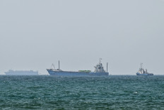 Vessels are anchored off the coast of Sharjah in the United Arab Emirates on May 21, 2026. Iran's new body overseeing the Strait of Hormuz said its claimed area of control extends to Emirati waters, drawing a sharp rebuke from the Gulf neighbor. Traffic through Hormuz, a vital global shipping conduit, has come under Iranian control since the outbreak of war with Israel and the United States on February 28.