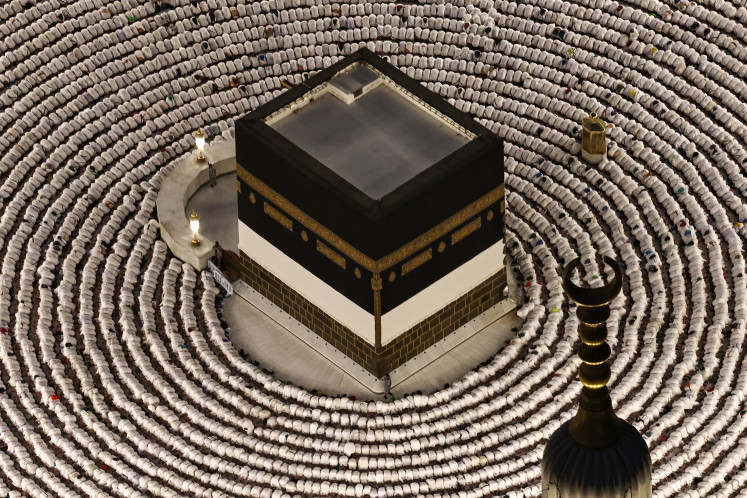 Silent devotion: Muslims perform the evening prayer on May 24 around the Kaaba, Islam&rsquo;s holiest site, at the Grand Mosque complex in Mecca, Saudi Arabia, ahead of the annual haj. Over 1.5 million pilgrims have arrived from outside the kingdom for the upcoming haj, according to a Saudi official, exceeding the number of international visitors last year despite the war in the Middle East.