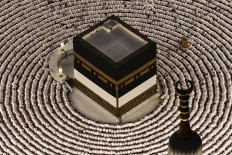 Silent devotion: Muslims perform the evening prayer on May 24 around the Kaaba, Islam&rsquo;s holiest site, at the Grand Mosque complex in Mecca, Saudi Arabia, ahead of the annual haj. Over 1.5 million pilgrims have arrived from outside the kingdom for the upcoming haj, according to a Saudi official, exceeding the number of international visitors last year despite the war in the Middle East.