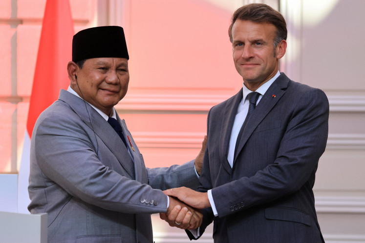 France's President Emmanuel Macron and Indonesia's President Prabowo Subianto shake hands at the end of a joint press statement at The Elysee Presidential Palace in Paris, France May 28, 2026.  