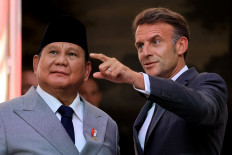 France's President Emmanuel Macron gestures next to Indonesia's President Prabowo Subianto on May 28 during a joint press statement at The Elysee Presidential Palace in Paris.