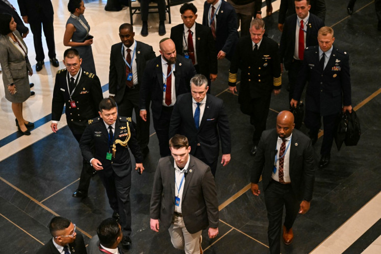 US Secretary of Defense Pete Hegseth (center) arrives for a bilateral meeting with Singapore's Defense Minister Chan Chun Sing on the sidelines of the Shangri-La Dialogue Summit in Singapore on May 29, 2026.