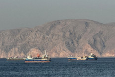 Vessels are seen anchored in the Strait of Hormuz, off the port city of Khasab on Oman&rsquo;s northern Musandam Peninsula on May 17, 2026.