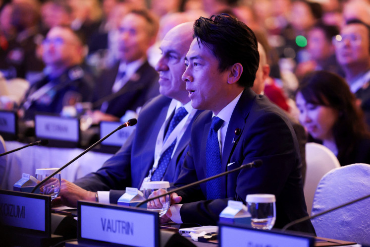 Japanese Defense Minister Shinjiro Koizumi asks a question to US Secretary of Defense Pete Hegseth at the IISS Shangri-La Dialogue security summit in Singapore, May 30, 2026. 