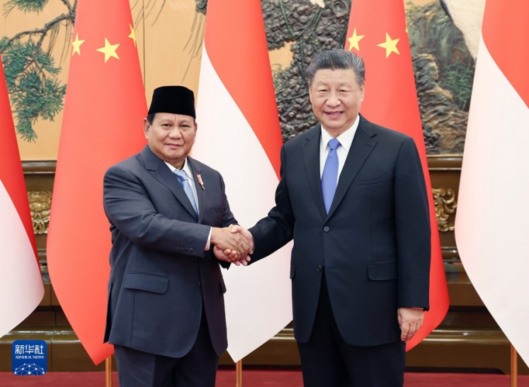 Defense Minister Prabowo Subianto (right) and Chinese President Xi Jinping pose for a photo-op during their high-profile bilateral meeting in Beijing, China on April 1, 2024. During his visit, the president-elect reiterated a commitment to maintain the close partnership that his predecessor, President Joko (Courtesy of Xinhua/-)