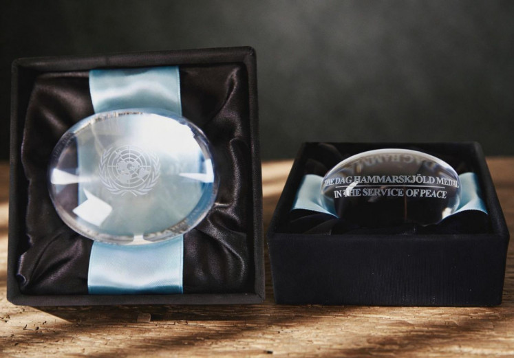 The Dag Hammarskj&ouml;ld Medal of the United Nations, a posthumous award given annually on Peacekeeper&rsquo;s Day to the families of military members, police personnel and personnel who lost their lives during peacekeeping operations, is displayed in this undated handout photo.