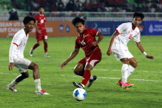 Indonesia U-19&rsquo;s Fabio Azkairawan (centre) battles Myanmar&rsquo;s Nyan Soe San (right) during their 2026 AFF U-19 Championship match at North Sumatra Main Stadium, Deli Serdang regency, on June 1, 2026. Indonesia won 3-0. 