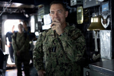 US Navy Admiral Brad Cooper, commander of US Central Command (CENTCOM), speaks with crew members of the Arleigh Burke-class guided-missile destroyer USS Milius (DDG 69), deployed to the US 5th Fleet area of operations to support maritime security and stability in the Middle East, in this handout photo released May 3, 2026. 