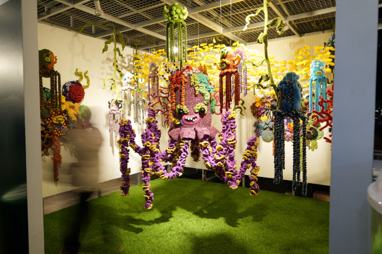 Yogyakarta-based artist Mulyana, also known as Mangmoel, collaborated with investment platform Bibit for Tentacles of Wealth, connecting the octopus's adaptability with an investment mindset in uncertain times.