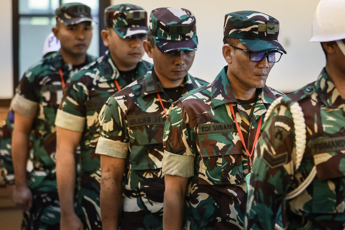 Defendants in the case of the acid attack on  KontraS activist Andrie Yunus, Sgt. Edi Sudarko (from right), 2nd Lt. Budhi Hariyanto Cahyono, Capt. Nandala Dwi Prasetya and 2nd Lt. Sami Lakka, attend a hearing for the reading of prosecutors' sentencing demands at Military Court II-08 in Jakarta on June 3, 2026. Military prosecutors sought prison sentences of two years and six months for each defendant, arguing they were proven guilty of committing the offense.