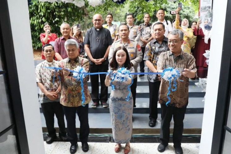 Acting Batam Mayor Li Claudia Chandra (center) cuts the ribbon while flanked by representatives of the Catholic Church on May 29, 2026, to officiate Caritas Sentrum in Batam city, Riau Islands. Caritas Sentrum, a center under the Indonesian Catholic Church, provides vocational training and assistance for migrant workers and human trafficking victims. 