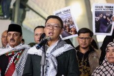 Foreign Minister Sugiono (center) addresses reporters on May 24, 2026, accompanied by the nine Indonesian members of the Gaza-bound Global Sumud Flotilla, upon their arrival at Soekarno-Hatta International Airport in Tangerang, Banten.