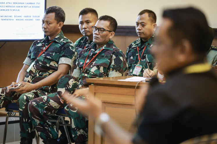 (From left to right) Defendants First Lt. Budhi Harytanto Cahyono, First Lt. Sami Lakka, Second Sgt. Edi Sudarko and Capt. Nandala Dwi Prasetya attend a hearing against them on June 2, 2026, regarding the acid attack on Commission of Missing Persons and Victims of Violence (Kontras) activist Andrie Yunus, at the Jakarta Military Court in Jakarta.