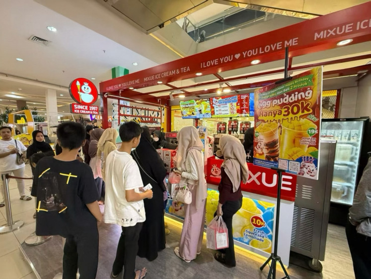 Customers wait in line on June 1, 2026, at a Mixue outlet in Kuningan City Mall in South Jakarta.