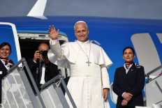Pope Leo XIV waves as he boards the papal plane at Fiumicino Airport, near Rome, Italy, on June 6, 2026 ahead of his apostolic journey to Spain.