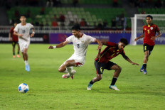Indonesian forward Arkhan Kaka (center left) leaps past Timor-Leste midfielder Jose Arango Da Cunha on June 4, 2026, during their AFF U-19 Cup soccer match at the North Sumatra Main Stadium of Deli Sport City in Deli Serdang regency, North Sumatra. Indonesia thrashed Timor-Leste 3-0.