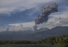 Mount Dukono spews volcanic ash on May 12, 2026, as seen from Mamuya village, North Halmahera regency, North Maluku.