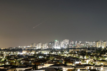 A streak of light illuminates the sky during a missile attack from Iran towards Israel as seen from Ashkelon, Israel, June 7, 2026.