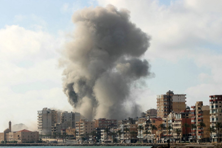 Smoke rises from the site of an Israeli airstrike that targeted a neighborhood in the southern Lebanese coastal city of Tyre on June 7, 2026. Israel and Hezbollah regularly exchange fire but the south of the capital -- including districts seen as bastions of the Iran-backed group -- has been relatively spared, having been struck only twice since mid-April. Israel later issued an evacuation warning for most of the southern Lebanese city of Tyre and its surroundings, a more frequent site of strikes.