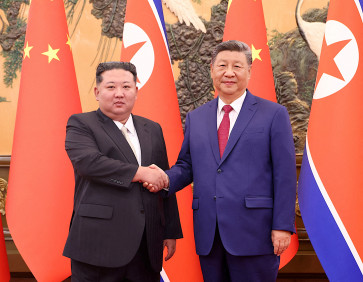 Chinese President Xi Jinping and Democratic People's Republic of Korea (DPRK) leader Kim Jong Un shake hands at the Great Hall of the People in Beijing, China September 4, 2025. 