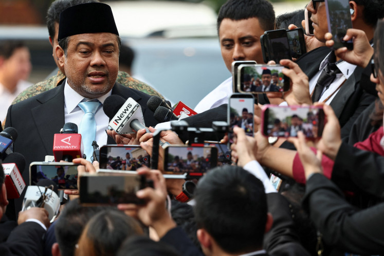 President of the Labor Party Said Iqbal, who is also Presidential special advisor for manpower and labor affairs, speaks to the media as he arrives at the Presidential Palace for his inauguration in Jakarta on June 8, 2026.
