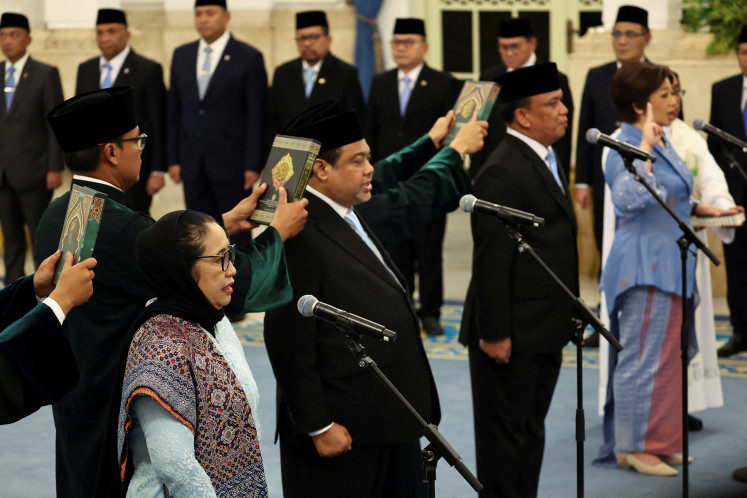 Head of National Nutrition Agency (BGN) Nanik Sudaryati Deyang along with her deputies Maj. Gen. Trenggono and Agustina Arumsari, and Said Iqbal, special presidential advisor for employment, take their oaths during their inauguration on June 8 at the State Palace in Jakarta.