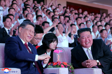 Chinese President Xi Jinping sits next to North Korean leader Kim Jong Un as he attends a performance at the Pyongyang Indoor Stadium, during his state visit, in Pyongyang, North Korea, June 8, 2026.   